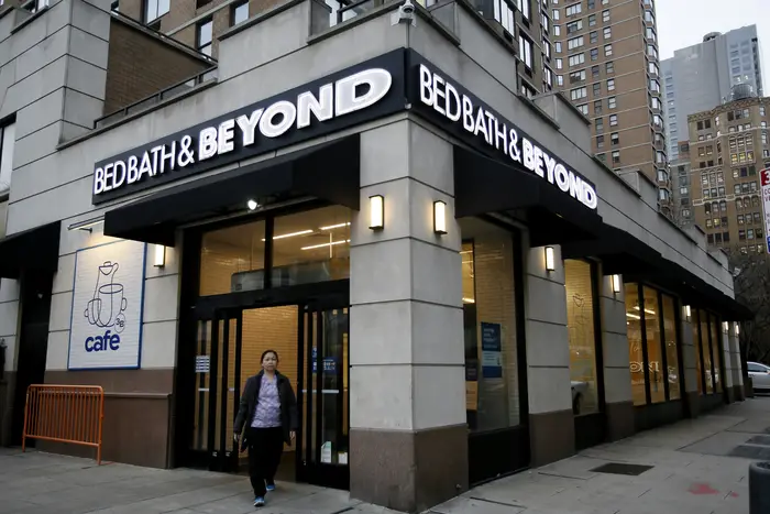 A woman walks near a Bed Bath & Beyond store in January in New York City. The company says it plans to wind down operations and close its remaining stores.